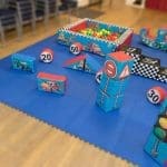 Transport-themed soft play set with ball pit and 19 vehicle soft play shapes, available for hire in Essex.