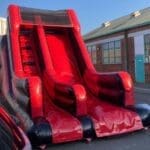 shiny red and black slide side view