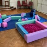 A multi-coloured pastel soft play set