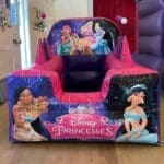 Disney Princess inflatable ball pool with air jugglers and colourful balls, perfect for princess parties and available for hire in Essex.