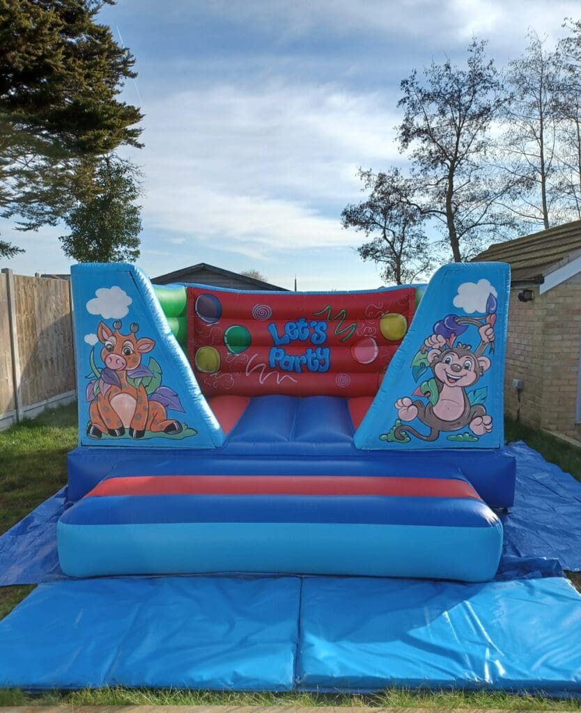 an 8ft jungle themed castle in red and blue