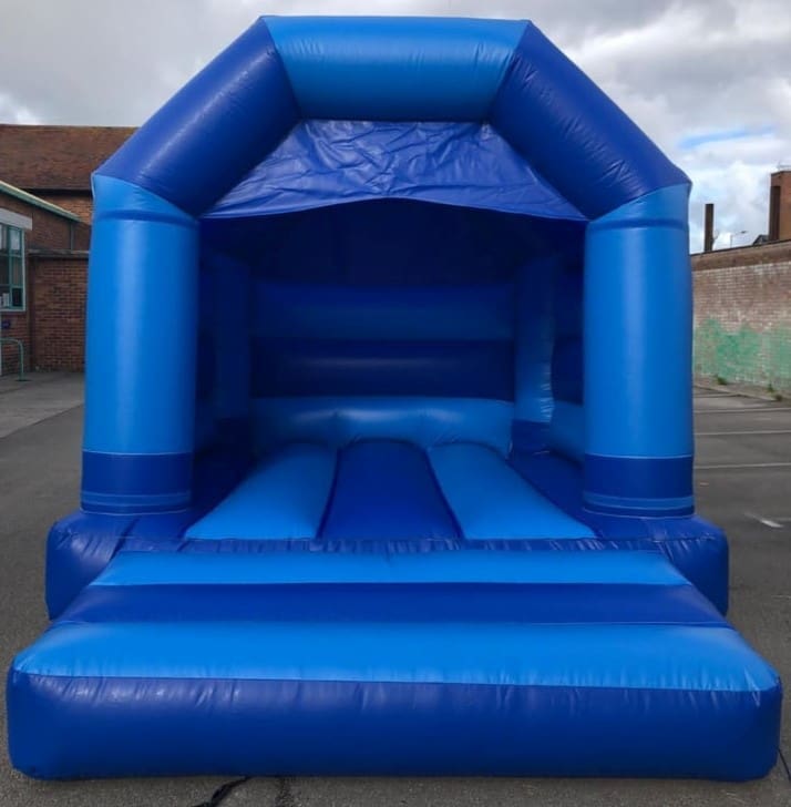 a small bouncy castle in a plain blue theme