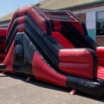 A 45ft red and black themed obstacle course end view