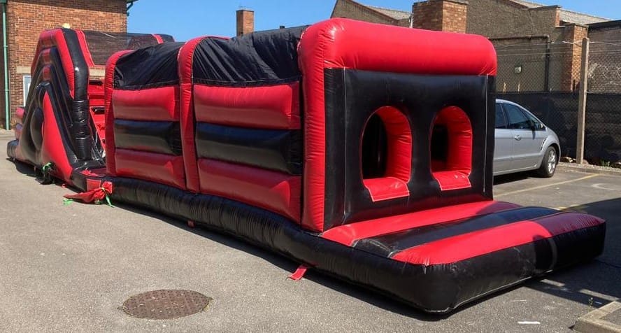 a 45ft red and black themed obstacle course start