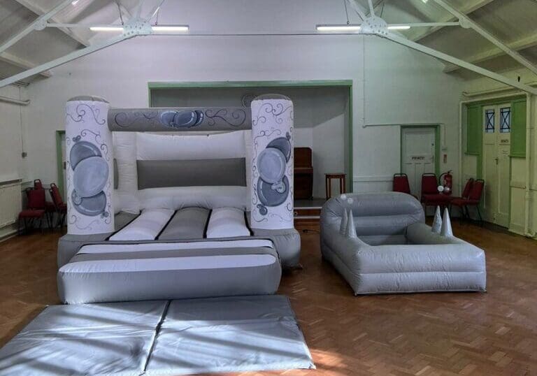 Silver & White castle with inflatable ball pool