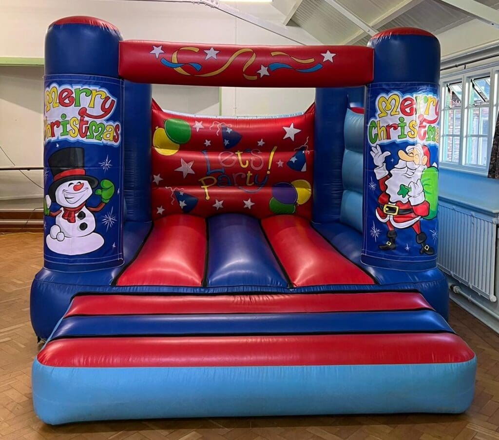 A Christmas themed velcro castle in red and blue