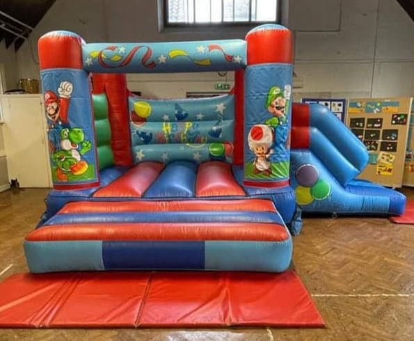 A Super Mario V1 velcro style bouncy castle with slide