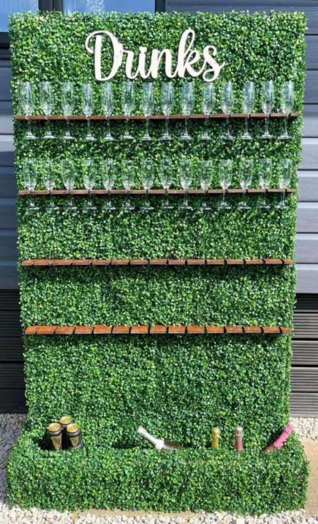 Champagne and prosecco wall holding over 55 flutes with bottle storage underneath – available for hire in Essex.
